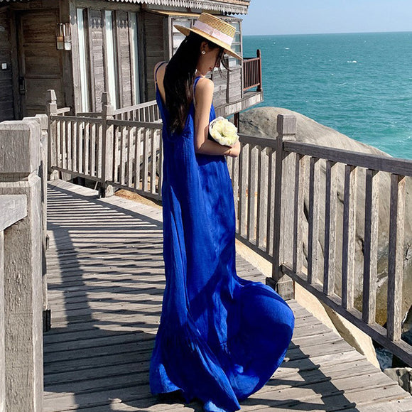 克萊因藍色沙灘裙夏吊帶性感露背顯瘦海邊度假超仙長款洋裝